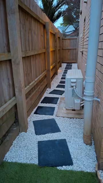 Customer photo of gravel and stepping stones beside a fence