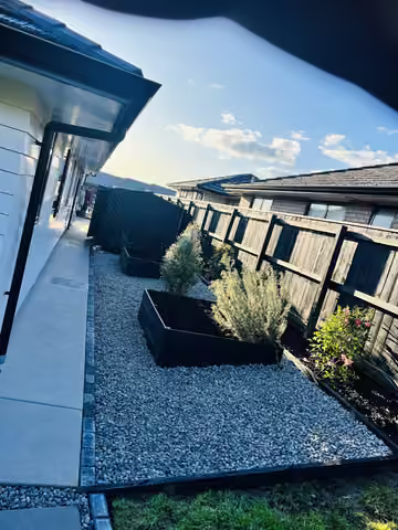 Raised garden beds surrounded by gravel